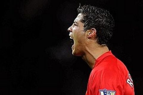 Manchester United's Portugese midfielder Cristiano Ronaldo celebrates after scoring the opening goal during the English Premier league football match against West Ham united at Old Trafford, Manchester, north-west England, on October 29 2008. AFP PHOTO/ANDREW YATES  Mobile and website use of domestic English football pictures are subject to obtaining a Photographic End User Licence from Football DataCo Ltd Tel : +44 (0) 207 864 9121 or e-mail accreditations@football-dataco.com - applies to Premier and Football League matches.