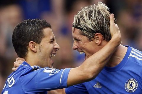 Chelsea's Eden Hazard (L) celebrates with team mate Fernando Torres after scoring against Newcastle United during their English Premier League soccer match at Stamford Bridge in London August 25, 2012. REUTERS/Stefan Wermuth (BRITAIN - Tags: SPORT SOCCER) NO USE WITH UNAUTHORIZED AUDIO, VIDEO, DATA, FIXTURE LISTS, CLUB/LEAGUE LOGOS OR "LIVE" SERVICES. ONLINE IN-MATCH USE LIMITED TO 45 IMAGES, NO VIDEO EMULATION. NO USE IN BETTING, GAMES OR SINGLE CLUB/LEAGUE/PLAYER PUBLICATIONS. FOR EDITORIAL USE ONLY. NOT FOR SALE FOR MARKETING OR ADVERTISING CAMPAIGNS