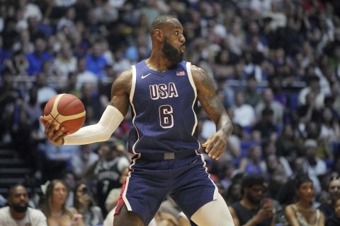 United States' forward LeBron James looks to pass the ball during an exhibition basketball game between the United States and South Sudan, at the o2 Arena in London, Saturday, July 20, 2024. (AP Photo/Kin Cheung)