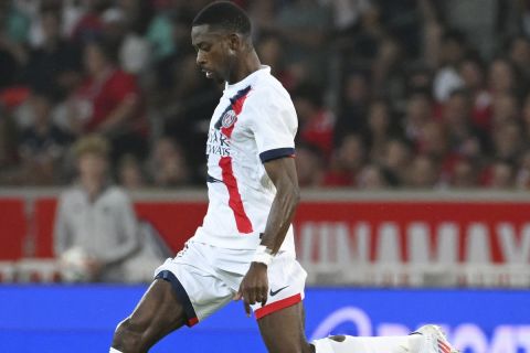 PSG's Ousmane Dembele takes a shot during the French League 1 soccer match between Lille and Paris Saint-Germain, in Villeneuve-d'Ascq, France, Sunday, Sept. 1, 2024. (AP Photo/Matthieu Mirville)