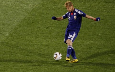 Japan's Keisuke Honda kicks the ball to score the opening goal during the World Cup group E soccer match between Denmark and Japan at Royal Bafokeng Stadium in Rustenburg, South Africa, on Thursday, June 24, 2010.  (AP Photo/Marcio Jose Sanchez)