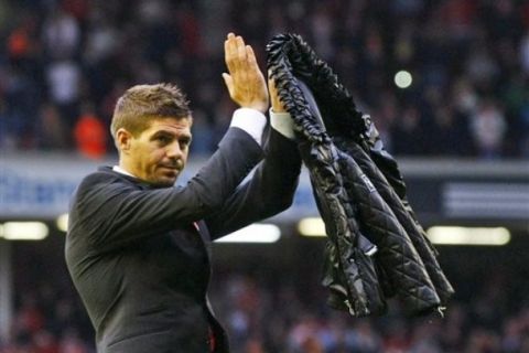 Injured Liverpool player Steven Gerrard applauds the fans after the English Premier League soccer match against Tottenham Hotspur at Anfield, Liverpool, England, Sunday May 15, 2011. (AP Photo/Tim Hales)  NO INTERNET/MOBILE USAGE WITHOUT FOOTBALL ASSOCIATION PREMIER LEAGUE (FAPL) LICENCE. CALL +44 (0) 20 7864 9121 or EMAIL info@football-dataco.com FOR DETAILS