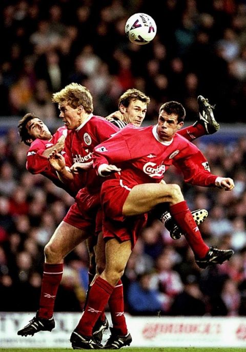 28 Dec 1998:  Karl Heinz Riedle, Steve Staunton and Jamie Carragher of Liverpool rise to deny Duncan Ferguson of Newcastle United in the FA Carling Premiership match at Anfield in Liverpool, England. Liverpool won 4-2.
Mandatory Credit: Clive Brunskill /Allsport