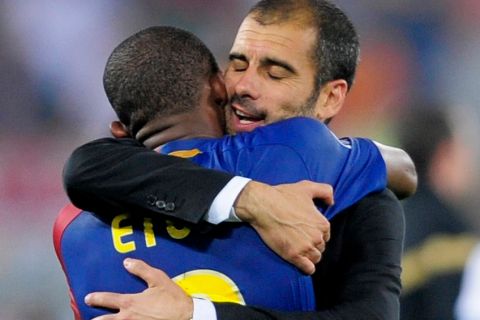 Barcelona coah Pep Guardiola hugs Samuel Eto'o at the end of the UEFA Champions League final soccer match between Manchester United and Barcelona in Rome, Wednesday May 27, 2009. Barcelona won 2-0. (AP Photo/Manu Fernandez)