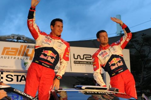 Sebastien Ogier (R) of France and compatriot co-driver Julien Ingrassia (L) wave to fans before the start of Round 10 of the World Rally Championship in Coffs Harbour on September 8, 2011. A field of 29 cars representing drivers from 22 countries will compete in 26 competitive stages over 369 kilometres on September 8-11.  AFP PHOTO / Torsten BLACKWOOD (Photo credit should read TORSTEN BLACKWOOD/AFP/Getty Images)