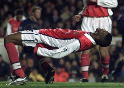 This picture can only be used within the context of an editorial feature. Arsenal's Kanu reacts after missing a goal during their FA Premiership match against Wimbledon at Highbury. Final score 1-1.  