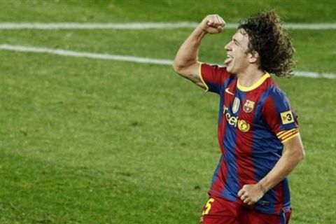 Barcelona's Carles Puyol celebrates his team's fifth goal during his La Liga soccer match against Real Madrid at the Camp Nou stadium, in Barcelona, Monday, Nov. 29, 2010.(AP Photo/Daniel Ochoa de Olza)