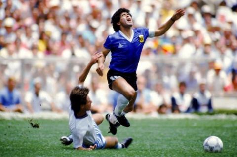 Argentina's Diego Maradona (right) is brought down by England's Terry Fenwick (left)