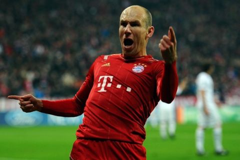 MUNICH, GERMANY - MARCH 13:  Arjen Robben of Muenchen celebrates after scoring his teams first goal during the UEFA Champions League Round of 16 second leg match between FC Bayern Muenchen and FC Basel 1893 at Allianz Arena on March 13, 2012 in Munich, Germany.  (Photo by Lars Baron/Bongarts/Getty Images)