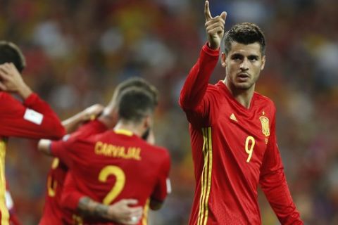 Spain's Alvaro Morata celebrates scoring his side's 3rd goal during the World Cup Group G qualifying soccer match between Spain and Italy at the Santiago Bernabeu stadium in Madrid, Spain, Saturday, Sept. 2, 2017. (AP Photo/Francisco Seco)