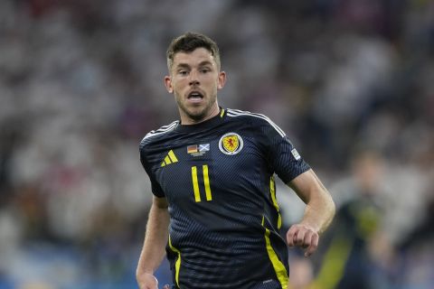 Scotland's Ryan Christie runs during the Group A match between Germany and Scotland at the Euro 2024 soccer tournament in Munich, Germany, Friday, June 14, 2024. (AP Photo/Antonio Calanni)