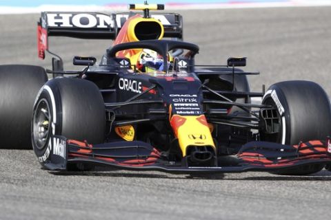 Red Bull driver Sergio Perez of Mexico steers his car during the third free practice at the Formula One Bahrain International Circuit in Sakhir, Bahrain, Saturday, March 27, 2021. The Bahrain Formula One Grand Prix will take place on Sunday. (AP Photo/Kamran Jebreili)