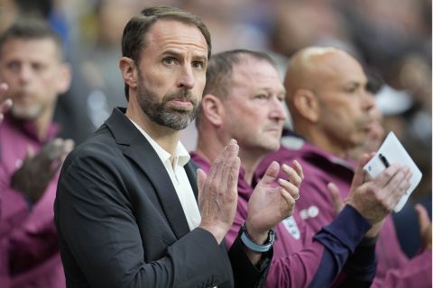 England's head coach Gareth Southgate applauds before the start of the International friendly soccer match between England and Iceland at Wembley stadium in London, Friday, June 7, 2024.(AP Photo/Kin Cheung)