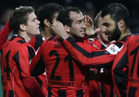 Eintracht Frankfurt's Thoefanis Gekas (C) celebrates a goal against Hamburg SV during their German Soccer Cup (DFB-Pokal) match in Frankfurt October 27, 2010. REUTERS/Alex Domanski (GERMANY - Tags: SPORT SOCCER) DFB RULES PROHIBIT USE IN MMS SERVICES VIA HANDHELD DEVICES UNTIL TWO HOURS AFTER A MATCH AND ANY USAGE ON INTERNET OR ONLINE MEDIA SIMULATING VIDEO FOOTAGE DURING THE MATCH