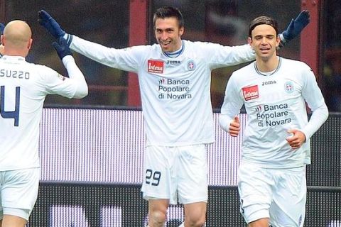 Novara forward Andrea Caracciolo (C) celebrates after scoring during a Serie A soccer match between Inter Milan and Novara at the Giuseppe Meazza  stadium in Milan, Italy, 12  February 2012. ANSA/DANIEL DAL ZENNARO