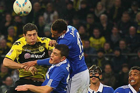 DORTMUND, GERMANY - NOVEMBER 26: (L-R) Robert Lewandowski of Dormtund, Kyriakos Papadopoulos and Jermaine Jones of Schalke go up for a header during the Bundesliga match between Borussia Dortmund and FC Schalke 04 at Signal Iduna Park on November 26, 2011 in Dortmund, Germany. (Photo by Christof Koepsel/Bongarts/Getty Images)