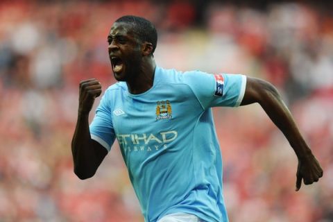 LONDON, ENGLAND - APRIL 16:  Yaya Toure of Manchester City celebrates scoring the opening goal during the FA Cup sponsored by E.ON semi final match between Manchester City and Manchester United at Wembley Stadium on April 16, 2011 in London, England.  (Photo by Mike Hewitt/Getty Images)