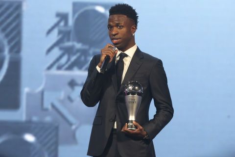 Vinicius Junior of Real Madrid talks after being awarded as the Best Men's FIFA Player during the FIFA Football Awards 2024 in Doha, Qatar, Tuesday, Dec. 17, 2024. (AP Photo/Hussein Sayed)