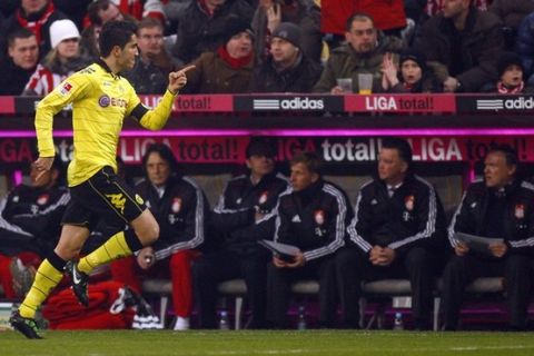 Borussia Dortmund's Nuri Sahin celebrates his goal during their German Bundesliga soccer match against Bayern Munich in Munich February 26, 2011. REUTERS/Thomas Bohlen (GERMANY - Tags: SPORT SOCCER) ONLINE CLIENTS MAY USE UP TO SIX IMAGES DURING EACH MATCH WITHOUT THE AUTHORITY OF THE DFL. NO MOBILE USE DURING THE MATCH AND FOR A FURTHER TWO HOURS AFTERWARDS IS PERMITTED WITHOUT THE AUTHORITY OF THE DFL. FOR MORE INFORMATION CONTACT DFL DIRECTLY