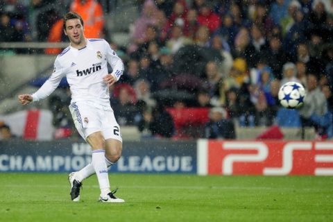 Real Madrid's Argentinian forward Gonzalo Higuain shoots to score during the Champions League semi-final second leg football match between Barcelona and Real Madrid at the Camp Nou stadium in Barcelona on May 3, 2011. Higuain's goal was disallowed. Barcelona qualified for the Champions League final after drawing 1-1 in their semi-final second leg clash with bitter rivals Real Madrid to progress 3-1 on aggregate.  AFP PHOTO/ JOSEP LAGO (Photo credit should read JOSEP LAGO/AFP/Getty Images)