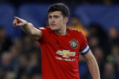 Manchester United's Harry Maguire gestures during the English League Cup soccer match between Chelsea and Manchester United at Stamford Bridge in London, Wednesday, Oct. 30, 2019. (AP Photo/Ian Walton)