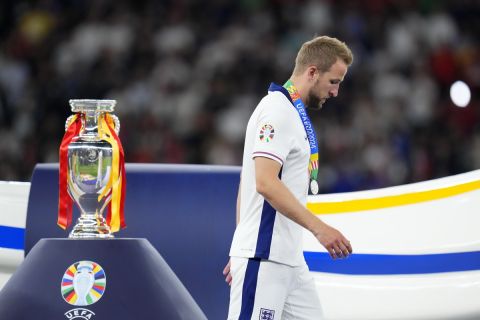 England's Harry Kane walks past the trophy after the final match between Spain and England at the Euro 2024 soccer tournament in Berlin, Germany, Sunday, July 14, 2024. Spain won 2-1. (AP Photo/Manu Fernandez)