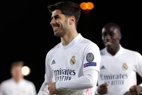 Real Madrid's Marco Asensio celebrates scoring his side's 3rd goal during the Champions League, round of 16, second leg soccer match between Atalanta and Real Madrid at the Alfredo di Stefano stadium in Madrid, Spain, Tuesday, March 16, 2021. (AP Photo/Bernat Armangue)