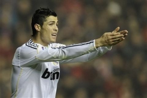 Real Madrid's  Ronaldo from Portugal reacts against Osasuna during their Spanish La Liga soccer match  at the Reyno de Navarra stadium in Pamplona, northern Spain Sunday Jan. 3, 2010. (AP Photo/Alvaro Barrientos)