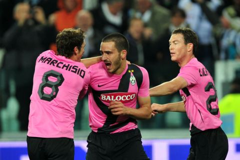 Juventus' defender Leonardo Bonucci (C) celebrates after scoring with teammates midfielder Claudio Marchisio (L) and Swiss defender Stephan Lichtseiner during their Serie A football match between Juventus and Fiorentina at the "Juventus Stadium" in Turin on October 25, 2011.    AFP PHOTO/ GIUSEPPE CACACE (Photo credit should read GIUSEPPE CACACE/AFP/Getty Images)