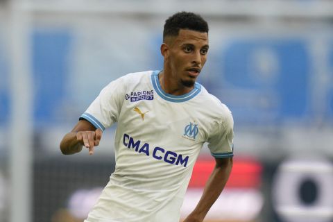 Marseille's Azzedine Ounahi challenges for the ball during the French League One soccer match between Marseille and Reims at the Velodrome stadium in Marseille, France, Saturday, Aug. 12, 2023. (AP Photo/Daniel Cole)