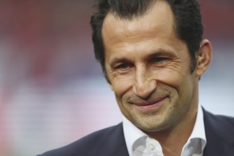 Bayern sports director Hasan Salihamidzic smiles prior to the start of the German Bundesliga soccer match between 1. FC Nuremberg and FC Bayern Munich in Nuremberg, Germany, Sunday, April 28, 2019. (AP Photo/Matthias Schrader)