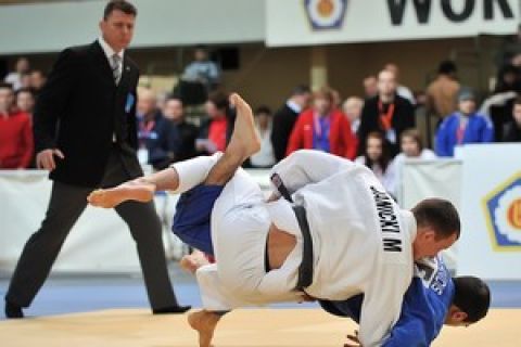 (WHITE) MARIUSZ JANICKI (POLAND) & (BLUE) LAVRETIS ALEXANIDIS (GREECE) DURING 66 KG WEIGHT CATEGORY FIGHT ON JUDO WORLD CUP MEN AT ARENA URSYNOW HALL IN WARSAW, POLAND.

WARSAW , POLAND , FEBRUARY 28, 2009

( PHOTO BY ADAM NURKIEWICZ / MEDIASPORT )