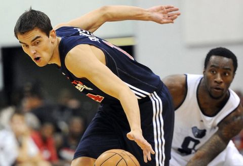 July 17, 2012; Las Vegas, NV, USA;   Washington Wizards player Tomas Satoransky (14) goes for the ball as Memphis Grizzlies player Tony Wroten (8) looks on in the game at Cox Pavilion. Mandatory Credit: Jayne Kamin-Oncea-US PRESSWIRE  