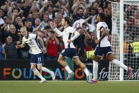 England's Jack Grealish, centre, celebrates after scoring his side second goal during the UEFA Nation's League soccer match between Ireland and England at the Aviva stadium in Dublin, Ireland, Saturday, Sept. 7, 2024. (AP Photo/Peter Morrison)