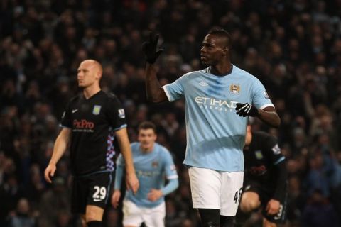 MANCHESTER, ENGLAND - DECEMBER 28:  Mario Balotelli of Manchester City shows three fingers as he celebrates after scoring his third goal during the Barclays Premier League match between Manchester City and Aston Villa at the City of Manchester Stadium on December 28, 2010 in Manchester, England.  (Photo by Alex Livesey/Getty Images)