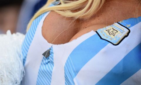 RIO DE JANEIRO, BRAZIL - JULY 13:  An Argentina fan enjoys the atmosphere prior to the 2014 FIFA World Cup Brazil Final match between Germany and Argentina at Maracana on July 13, 2014 in Rio de Janeiro, Brazil.  (Photo by Laurence Griffiths/Getty Images)