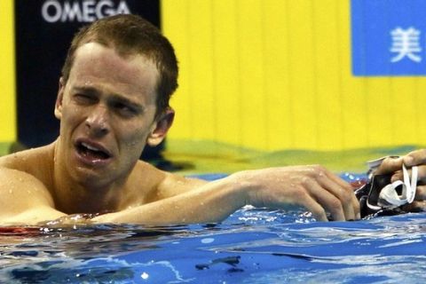 Cesar Cielo of Brazil cries after winning the men's 50m butterfly final at the 14th FINA World Championships in Shanghai July 25, 2011.    REUTERS/Issei Kato (CHINA  - Tags: SPORT SWIMMING AQUATICS)