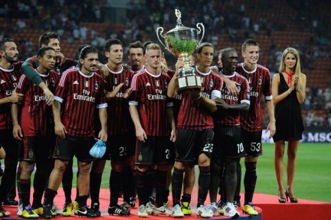 AC Milan players pose  after winning  the Trophee Luigi Berlusconi match AC Milan against Juventus, 2-1,  on August 21, 2011, in San Siro stadium in Milan . AFP PHOTO / OLIVIER MORIN (Photo credit should read OLIVIER MORIN/AFP/Getty Images)